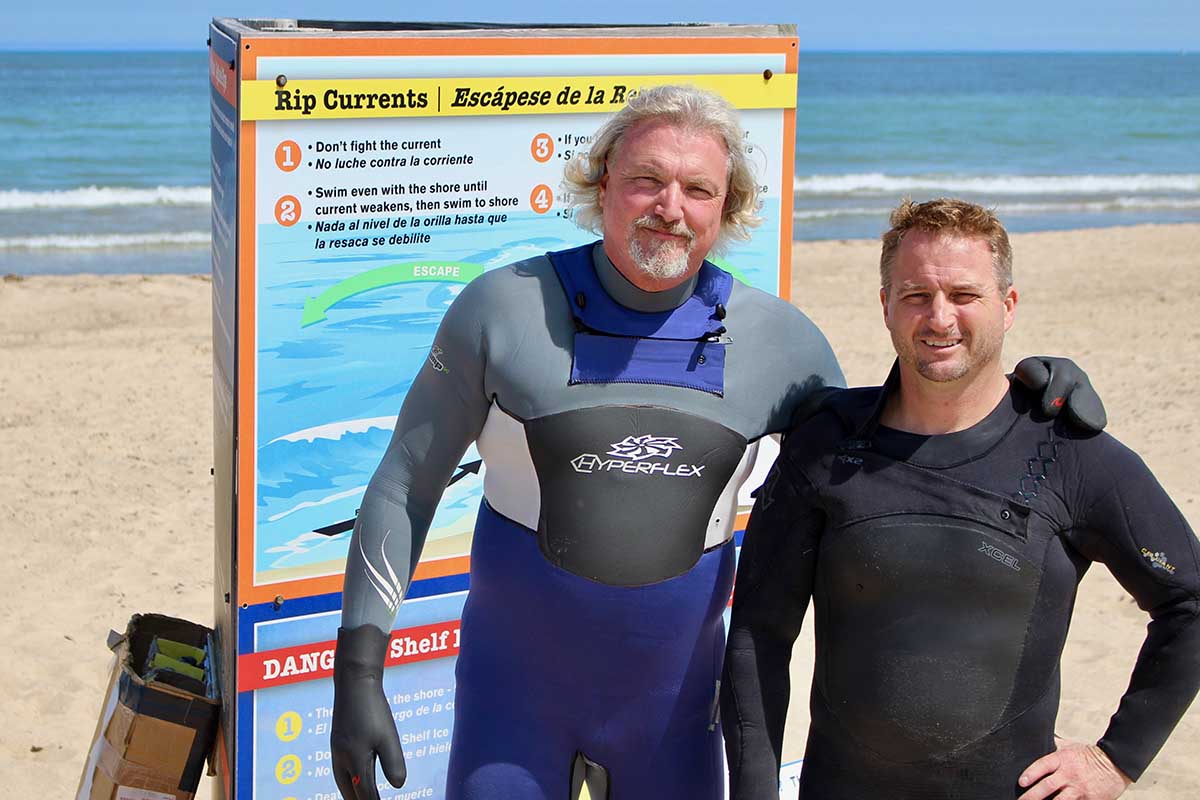 Bob Pratt (left), poses with Dave Benjamin, his partner at the nonprofit Great Lakes Surf Rescue Project. (Bridge photo by Jim Malewitz)