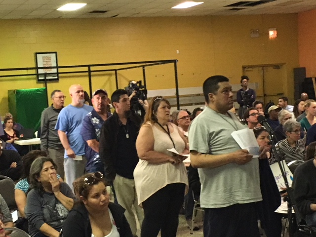 Southeast side Chicago residents line up to speak on air quality problems in their neighborhood. Photo by Gary Wilson